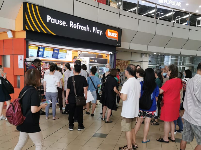 People waiting for the sale of surgical masks to start at Buzz convenience stores on Feb 20, 2020, were turned away at the last minute because Singapore Press Holdings, which owns the stores, decided to donate the masks to charities instead.