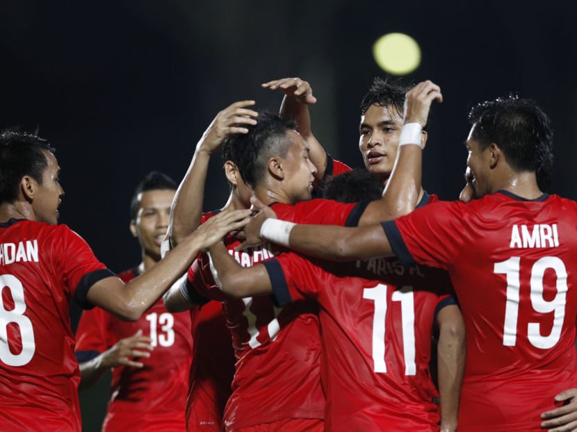The Lions celebrate their 4-2 victory against Cambodia at the Yishun Stadium. Photo: Wee Teck Hian