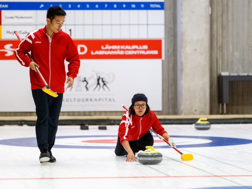 The author, seen here with his mixed doubles partner Sarah Cai, said that his four years of experience in curling has inspired him to spread the joy of playing the sport to other Singaporeans.
