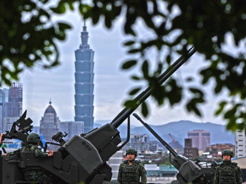 This handout photo from Taiwan’s Ministry of National Defense released on April 9, 2023 shows Taiwanese soldiers manning anti-aircraft artillery near Taipei, as China conducts military exercises around the self-ruled island. 

