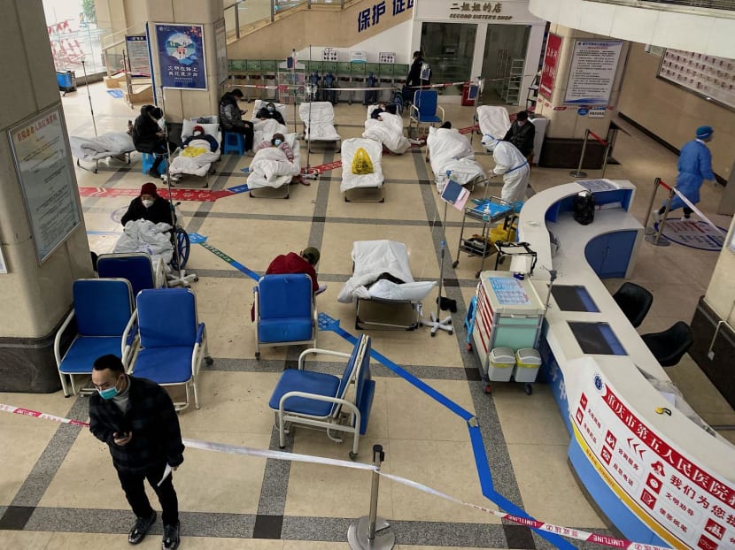 Covid-19 coronavirus patients lie on hospital beds in the lobby of the Chongqing No. 5 People's Hospital in China's southwestern city of Chongqing on Dec 23, 2022.