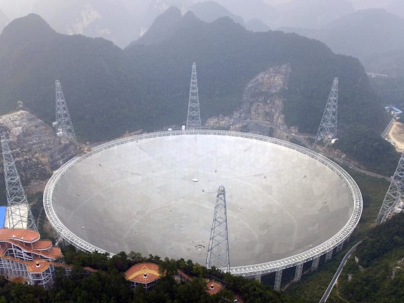 An aerial view shows the Five-hundred-meter Aperture Spherical Telescope (FAST) in the remote Pingtang county in southwest China's Guizhou province on Sept 25, 2016. Photo: Chinatopix via AP