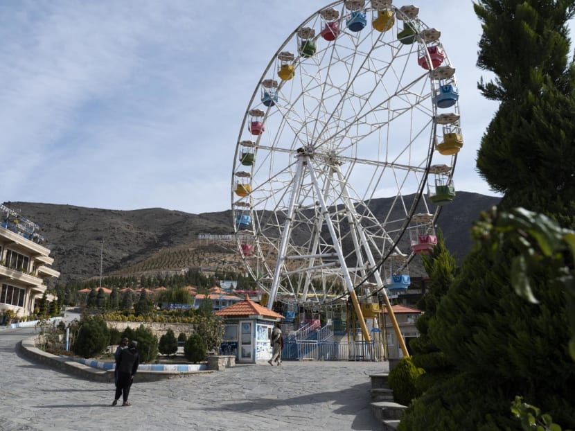 This photograph taken on Nov 9, 2022, shows Taliban guards standing next to a ferry wheel ride at the Habibullah Zazai Park on the outskirts of Kabul. The Taliban have banned Afghan women from entering the capital's public parks and funfairs, just months after ordering access to be segregated by gender.
This photograph taken on Nov 9, 2022, shows Taliban guards standing next to a ferry wheel ride at the Habibullah Zazai Park on the outskirts of Kabul. The Taliban have banned Afghan women from entering the capital's public parks and funfairs, just months after ordering access to be segregated by gender.