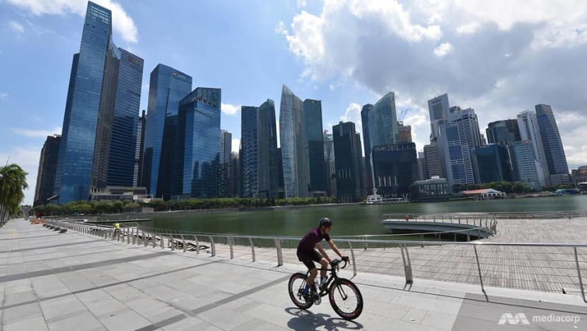 cyclist rides along marina bay promenade during singapore s circuit breaker period 0