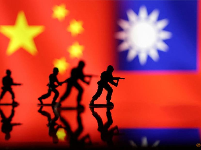 FILE PHOTO: Solider miniatures are seen in front of displayed Chinese and Taiwanese flags in this illustration taken, April 11, 2023. REUTERS/Dado Ruvic/Illustration/File Photo