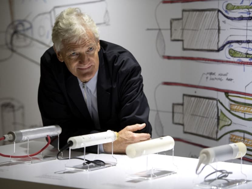 British industrial design engineer and founder of the Dyson company, Mr James Dyson, poses with products during a photo session at a hotel in Paris on Oct 11, 2018.