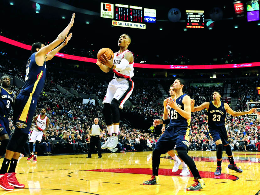 Bryant singled out Trail Blazers point guard Damian Lillard (centre) as a player deserving of votes. Photo: REUTERS