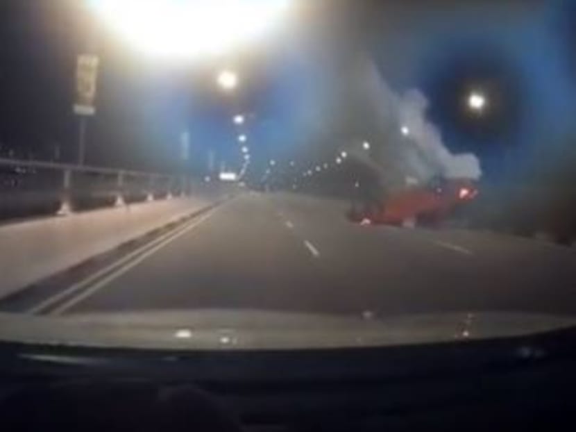 A screengrab from a video posted on TikTok showed the overturned red car after it rear-ended a white car along Nicoll Highway.