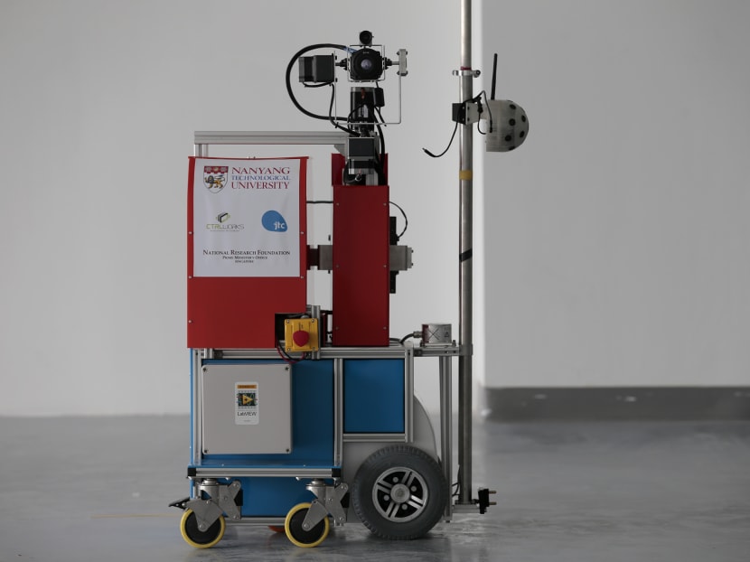 QuicaBot, invented by a group of four scientists from Nanyang Technological University, is able to inspect indoor spaces using laser scanners and high-tech cameras, to help detect defects and uneven surfaces. Photo: Jason Quah