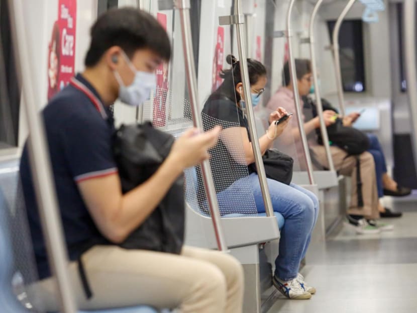 Commuters on an MRT train. Commuters on an MRT train.