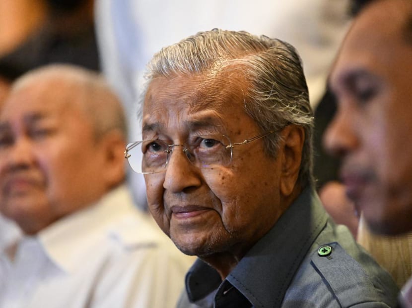Former Malaysian Prime Minister Mahathir Mohamad listens to questions during a press conference in Putrajaya in October 2022.