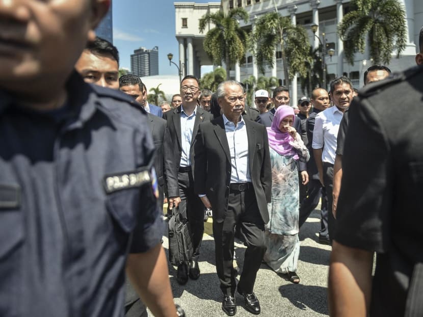 Former prime minister of Malaysia and Perikatan Nasional (PN) chairman Muhyiddin Yassin walks outside Kuala Lumpur High Court after being charged with corruption on March 10, 2023.