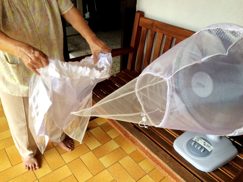 A Jalan Girang resident showing the fan trap placed in her home. The fan-based mosquito traps have been placed in some homes in Braddell Heights as part of a small-scale field study. Photo: Neo Chai Chin