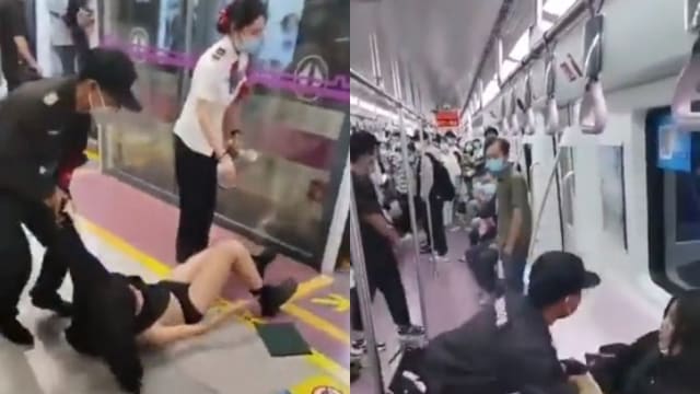 中国女子地铁内情绪失控 保安强制拖走露出内衣裤