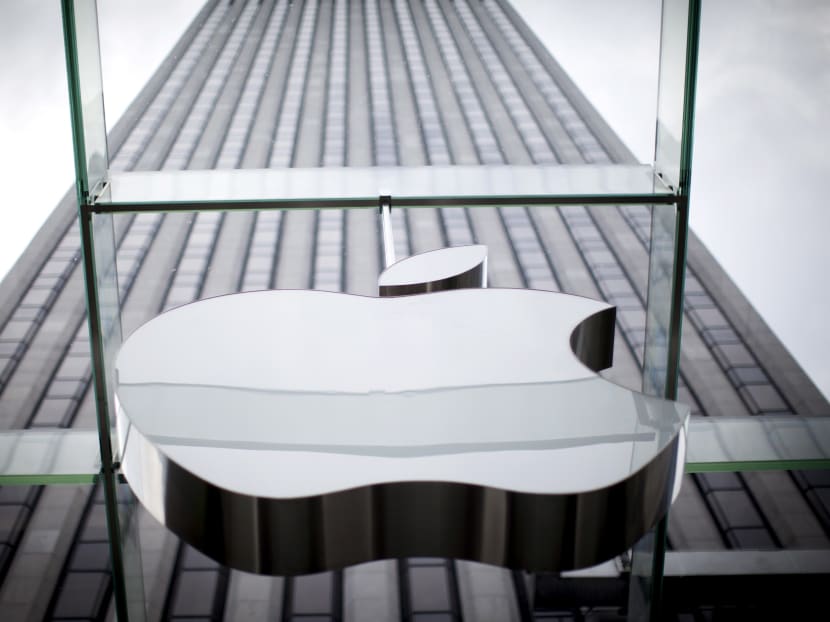 An Apple logo hangs above the entrance to the Apple store on 5th Avenue in the Manhattan borough of New York City, on July 21, 2015. Photo: Reuters