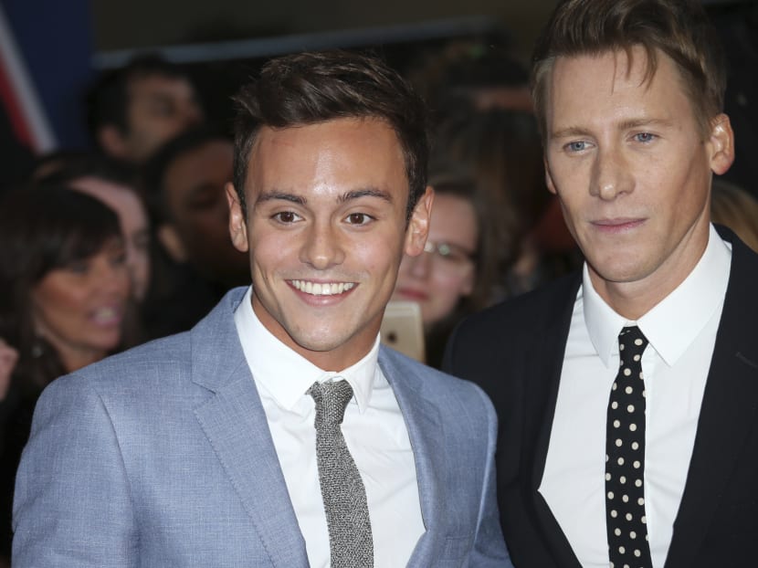British Olympic diver Tom Daley and Oscar-winning screenwriter Dustin Lance Black, right as they pose for photographers upon arrival at the Pride of Britain Awards 2015 in London on Sept 28, 2015. Photo: AP