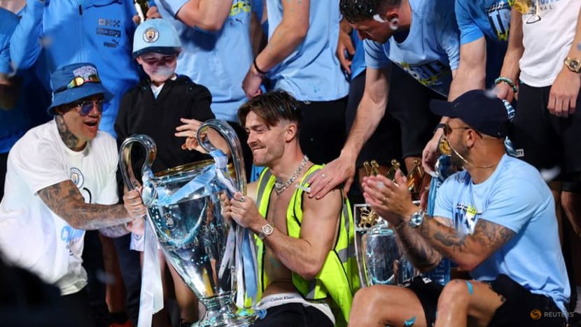 Manchester City dance in the rain to celebrate treble 