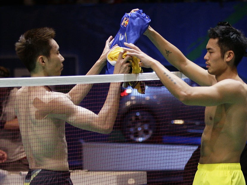 Lee Chong Wei (left) of Malaysia exchanging shirts with Lin Dan of China at the All England Badminton Championships in Birmingham, central England in 2012. Lin wants his long-time nemesis Lee to focus on recovering, after news broke last week of the Malaysian suffering from early stage nasal cancer.