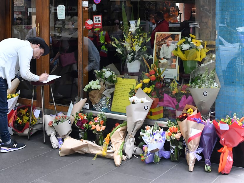 Floral tributes can be seen outside Melbourne's Pellegrini's Cafe, a day after an attack police have called an act of terrorism, in central Melbourne, Australia, November 10, 2018.