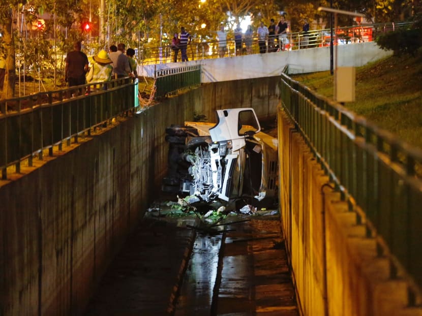 A man was conveyed to the Singapore General Hospital on Wednesday (Feb 7) afternoon after he lost control of his vehicle, which plunged into a canal along Lower Delta Road. Photo: Raj Nadarajan/TODAY