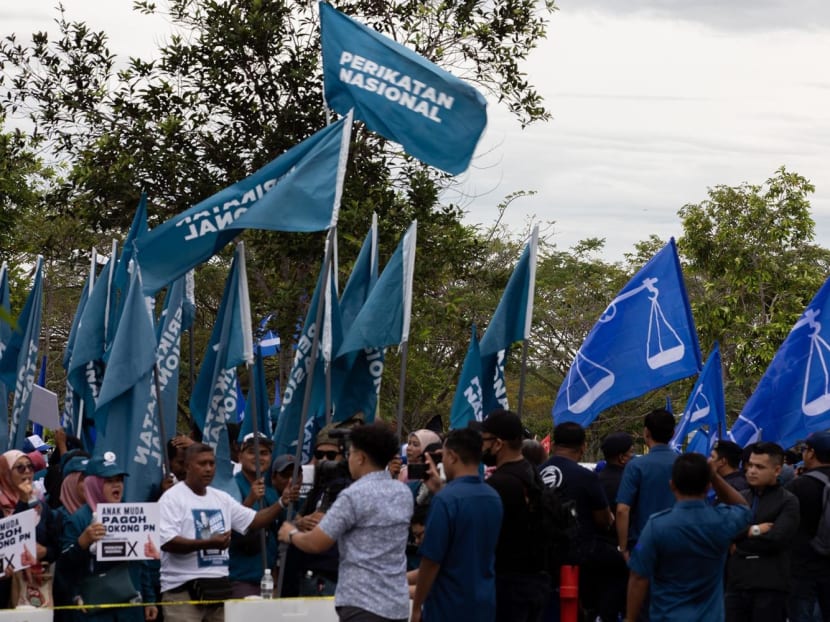 Perikatan Nasional and Barisan Naisonal supporters outside the nomination centre at Pagoh, Johor, on Nov 5, 2022. 