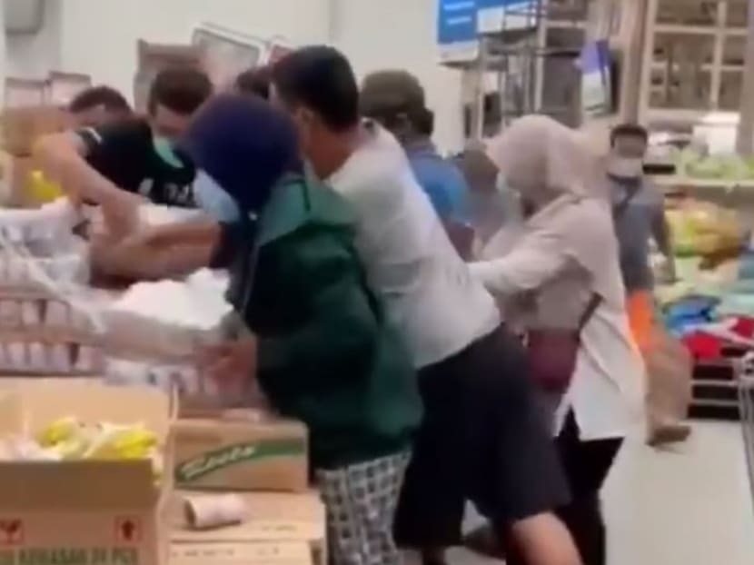 Shoppers captured in a viral social media video shoving others to get their hands on a carton of Nestle's Bear Brand sterilised milk in Tangerang, Indonesia, after rumours surfaced that it could kill the coronavirus.