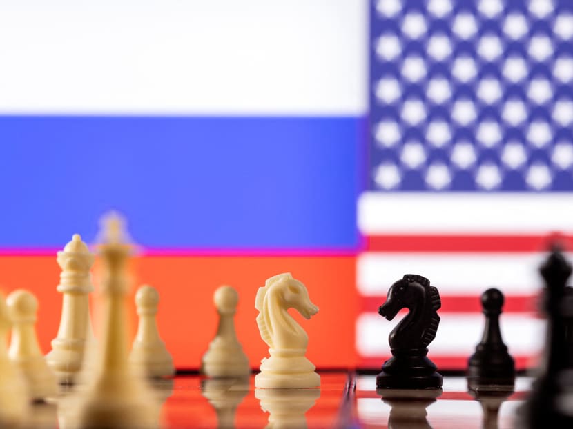 Chess pieces are seen in front of Russian and US flags in this illustration taken on Jan 26, 2022.