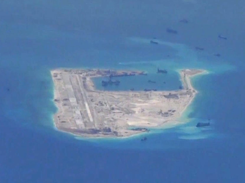 Chinese dredging vessels are purportedly seen in the waters around Fiery Cross Reef in the disputed Spratly Islands in the South China Sea in this still file image from video taken by a P-8A Poseidon surveillance aircraft provided by the United States Navy May 21, 2015.  Photo: Reuters
