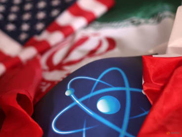 FILE PHOTO: Atomic symbol and USA and Iranian flags are seen in this illustration taken, September 8, 2022. REUTERS/Dado Ruvic/Illustration/File Photo