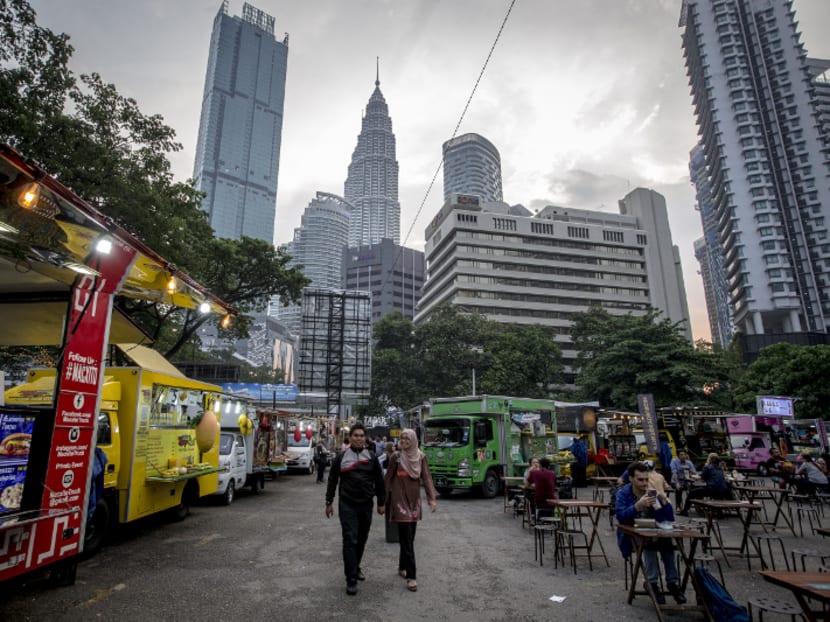 Food trucks seen at ‘Tapak: Urban Street Dining’ along Jalan Ampang. The place was previously a parking lot, but is now operated by a private company to house food trucks for a fee. Photo: Malay Mail Online