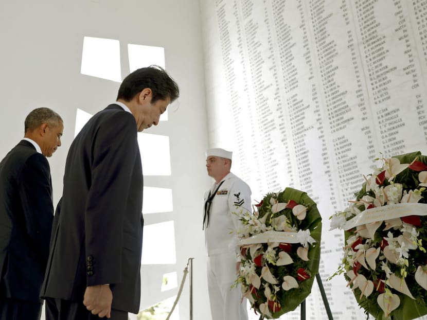 Japanese Prime Minister Shinzo Abe and US President Barack Obama at the USS Arizona Memorial at Joint Base Pearl Harbor-Hickam, Hawaii, last year. Obama’s and Abe’s respective visits to Hiroshima and Pearl Harbour brought healing to those hurt. Photo: AP