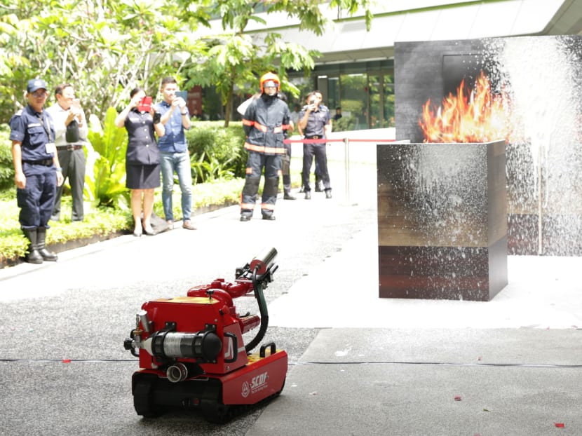 The Red Rhino Robot demonstrating its capabilities at the SCDF Workplan Seminar. The SCDF will be piloting several new technologies such as the use of robotics in firefighting and smart vests for officers that can transmit information on their health status back to the headquarters.