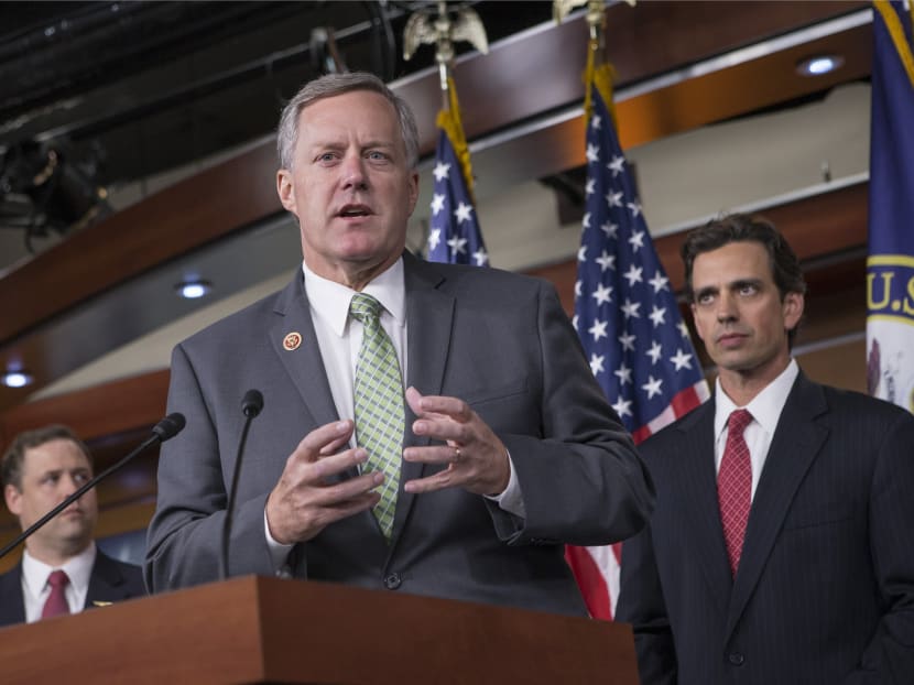 Rep Mark Meadows (center), Rep Tom Graves (right) and other conservative Republicans discuss their goal of obstructing the Affordable Care Act, popularly known as Obamacare, as part of a strategy to pass legislation to fund the government, on Capitol Hill in Washington on Sept 19, 2013. Photo: AP