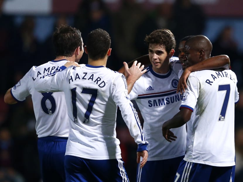 Chelsea's Oscar celebrates with team mates after scoring a penalty against West Ham. Photo: REUTERS