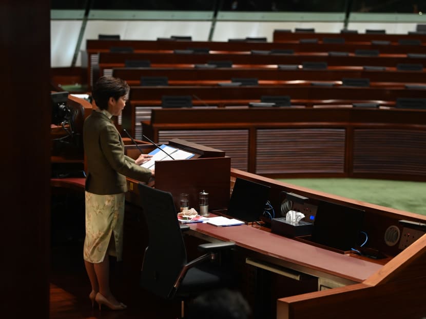 Hong Kong Chief Executive Carrie Lam gives her annual Policy Address in front of empty seats where the democrats used to sit at the Legislative Council in Hong Kong on Nov 25, 2020.