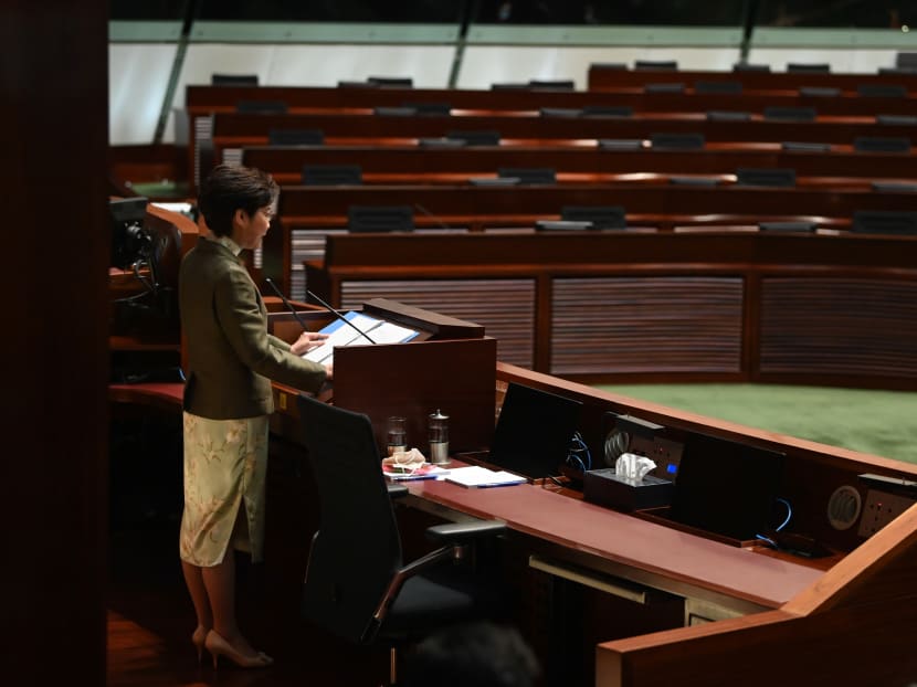 Hong Kong Chief Executive Carrie Lam gives her annual Policy Address in front of empty seats where the democrats used to sit at the Legislative Council in Hong Kong on Nov 25, 2020. Hong Kong Chief Executive Carrie Lam gives her annual Policy Address in front of empty seats where the democrats used to sit at the Legislative Council in Hong Kong on Nov 25, 2020.