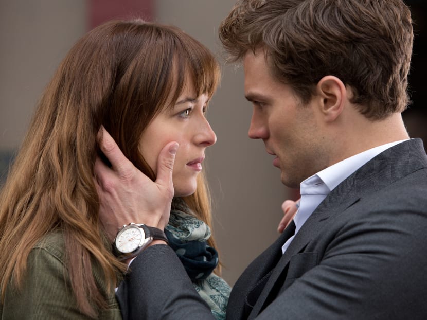 In this image released by Universal Pictures and Focus Features, Dakota Johnson (left) and Jamie Dornan appear in a scene from the film, Fifty Shades of Grey.  Photo: AP