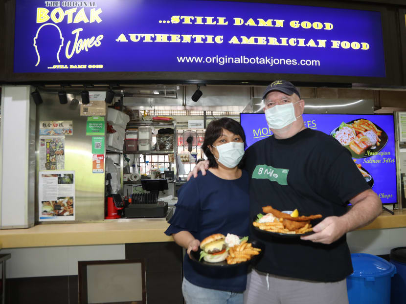 Founder of Botak Jones Bernard Utchenik with his wife Faudziah Mohd Ali in front of their new outlet at Depot Lane.