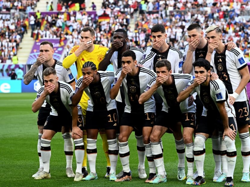 Germany's hands-over-mouths protest, a reaction to being barred from wearing a "OneLove" armband, was swiftly followed by accusations of anti-Arab racism and taunts over the country's Nazi past. Germany's hands-over-mouths protest, a reaction to being barred from wearing a "OneLove" armband, was swiftly followed by accusations of anti-Arab racism and taunts over the country's Nazi past.