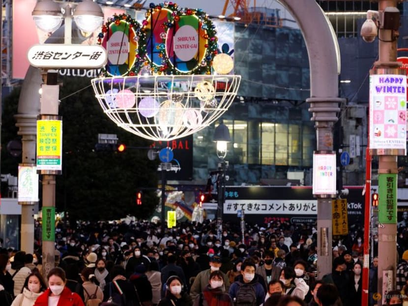 FILE PHOTO: People make their way at a shopping district in Tokyo, Japan December 23, 2022. REUTERS/Kim Kyung-Hoon FILE PHOTO: People make their way at a shopping district in Tokyo, Japan December 23, 2022. REUTERS/Kim Kyung-Hoon