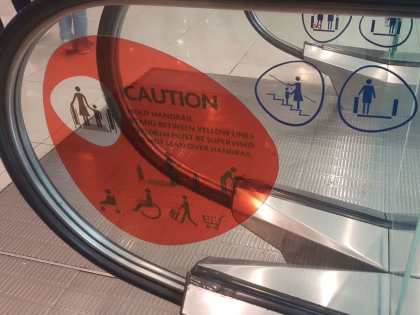 Signs at VivoCity cautioning shoppers against bringing stroller or bulky items onto escalators. Photo: VivoCity