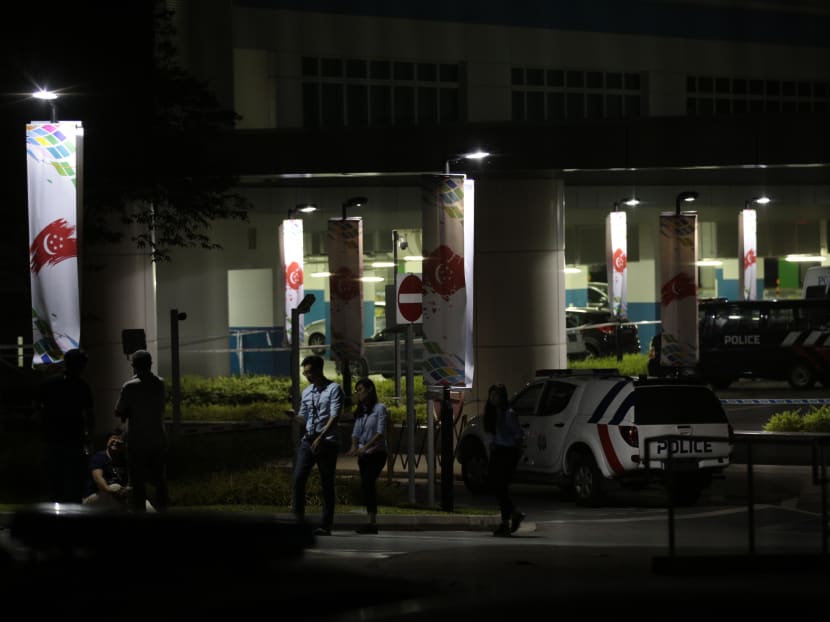 Police officers are seen at a crime scene in ITE College Central where a 56-year-old woman was allegedly stabbed to death by a 66-year-old man on July 19, 2018.