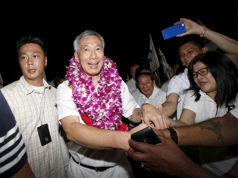 Prime Minister Lee Hsien Loong celebrates with supporters after the general election results on Sept 12, 2015. Photo: Reuters