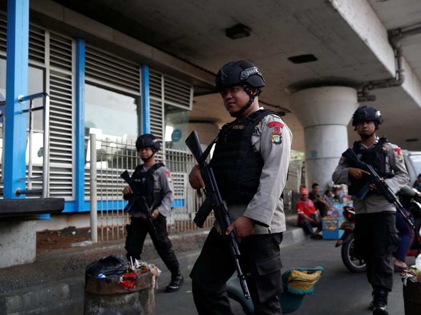 Police patrol near the scene of an explosion at a bus station in Kampung Melayu, Jakarta, Indonesia May 25, 2017. Photo: Reuters