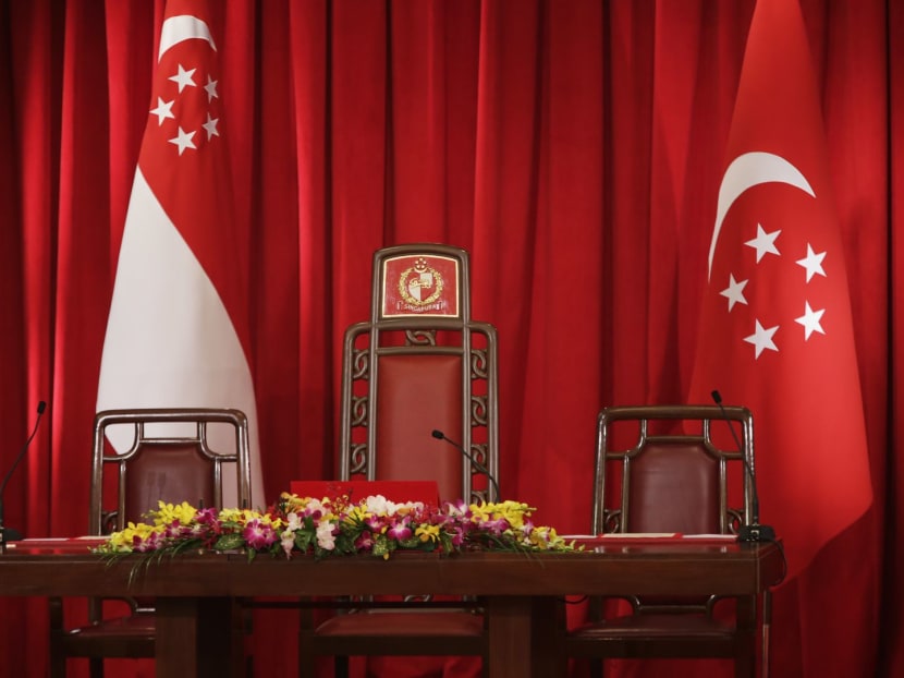 The Presidential Chair flanked by the State Flag and the Presidential Flag at the Istana.