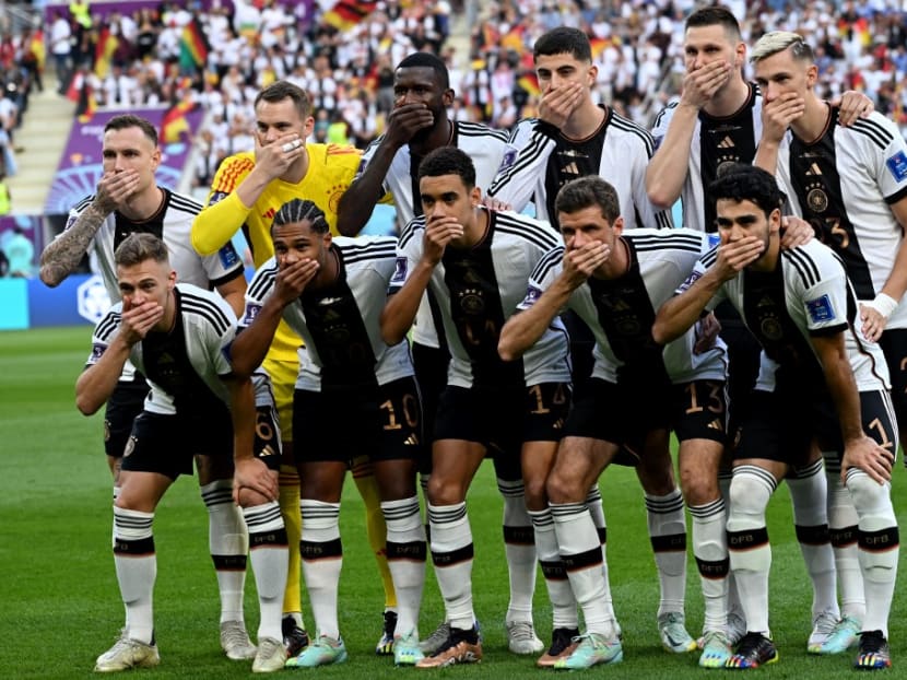 German players gesture as they pose for the group picture ahead of the Qatar 2022 World Cup Group E football match between Germany and Japan at the Khalifa International Stadium in Doha on Nov 23, 2022.
German players gesture as they pose for the group picture ahead of the Qatar 2022 World Cup Group E football match between Germany and Japan at the Khalifa International Stadium in Doha on Nov 23, 2022.