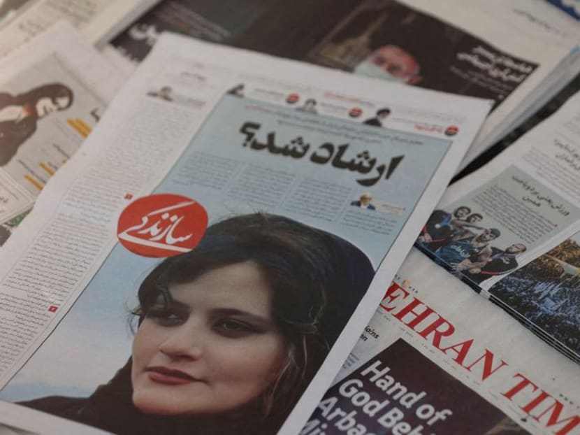 FILE PHOTO: A newspaper with a cover picture of Mahsa Amini, a woman who died after being arrested by Iranian morality police is seen in Tehran, Iran, September 18, 2022. Majid Asgaripour/WANA (West Asia News Agency) via REUTERS//File Photo FILE PHOTO: A newspaper with a cover picture of Mahsa Amini, a woman who died after being arrested by Iranian morality police is seen in Tehran, Iran, September 18, 2022. Majid Asgaripour/WANA (West Asia News Agency) via REUTERS//File Photo