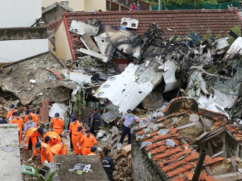 Gallery: Relatives fly to Taiwan plane crash site, 48 dead