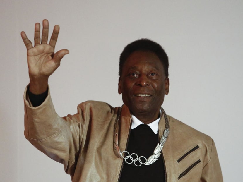 Brazilian retired footballer Edson Arantes do Nascimento, know as Pele, waves after being decorated with an Olympic Order Medal at the Pele Museum in Santos, Sao Paulo, Brazil on June 16, 2016. Brazilian retired footballer Edson Arantes do Nascimento, know as Pele, waves after being decorated with an Olympic Order Medal at the Pele Museum in Santos, Sao Paulo, Brazil on June 16, 2016.