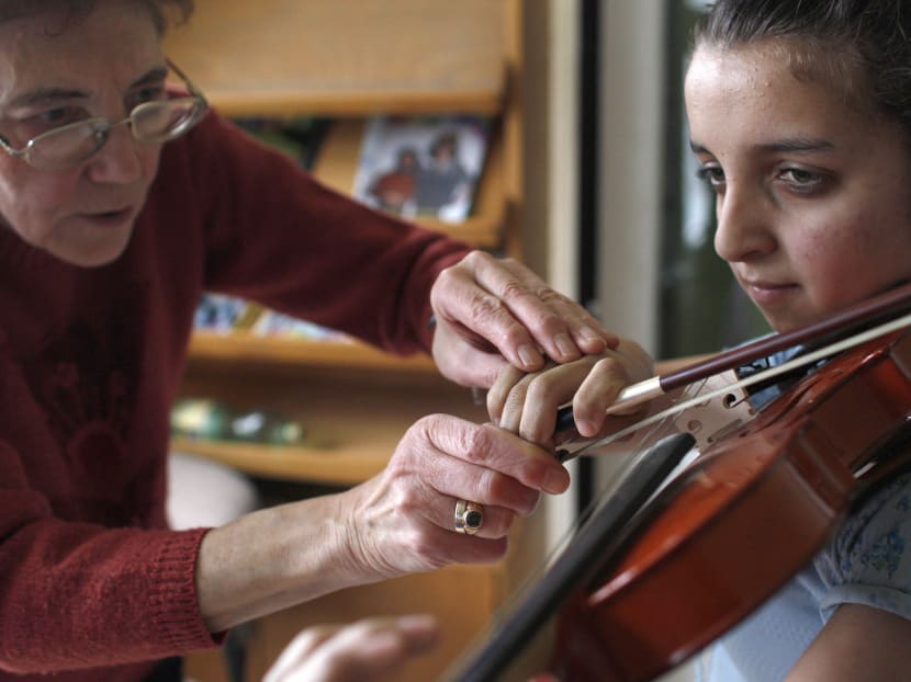 It is especially important to find a teacher that not only connects with your child but is also a highly-qualified musician in his or her own right. Photo: Reuters